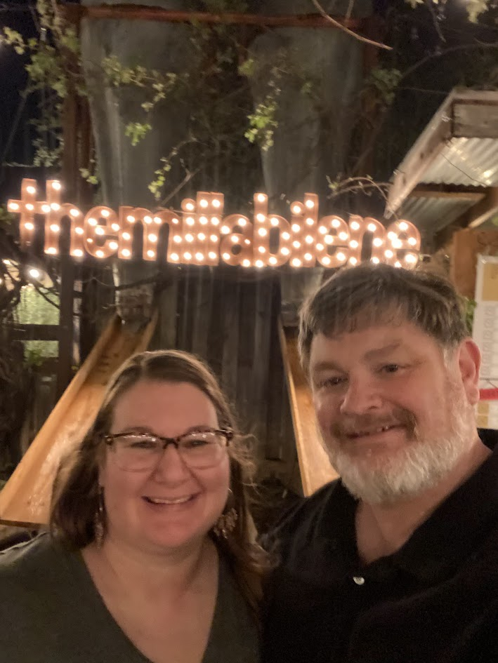Todd and Jill Dole smiling together at The Mill wine bar.